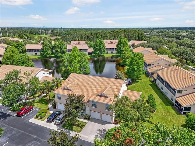 an aerial view of a house with outdoor space