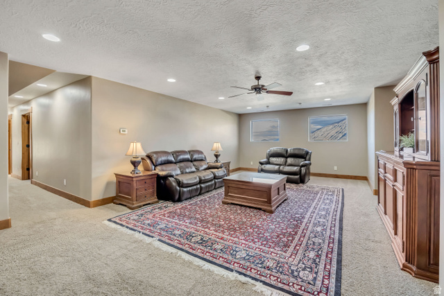 896 West 675 South Mapleton, UT 84664 - Photo 30 of 77 Living area featuring a textured ceiling, recessed lighting, light carpet, and ceiling fan