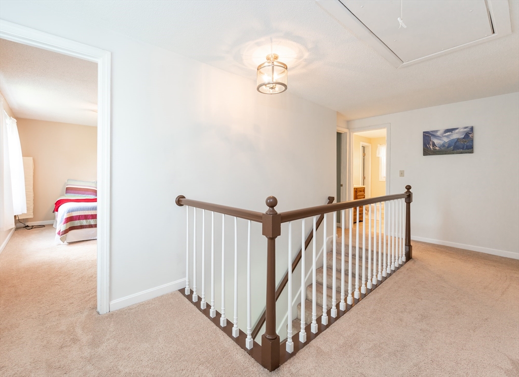 11 Emerson Road Nashua, NH 03062 - Photo 14 of 35 a view of a livingroom with furniture and staircase