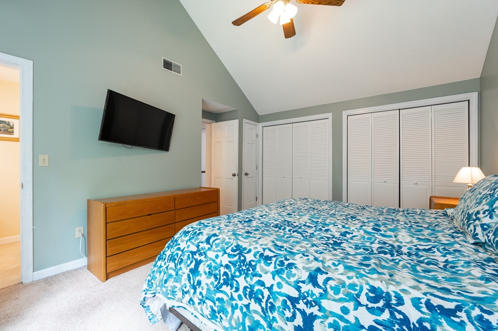 11 Emerson Road Nashua, NH 03062 - Photo 16 of 35 a bedroom with a bed and a flat screen tv