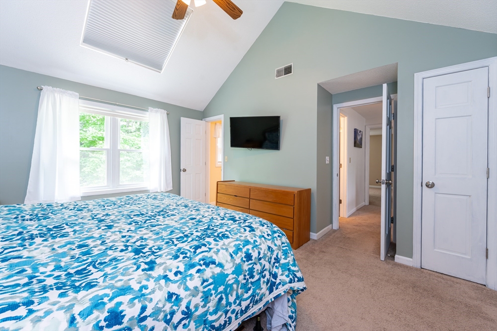 11 Emerson Road Nashua, NH 03062 - Photo 17 of 35 a bedroom with a bed and a flat screen tv