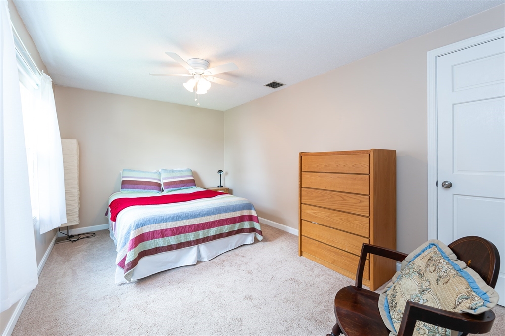 11 Emerson Road Nashua, NH 03062 - Photo 20 of 35 a bedroom with a bed and furniture