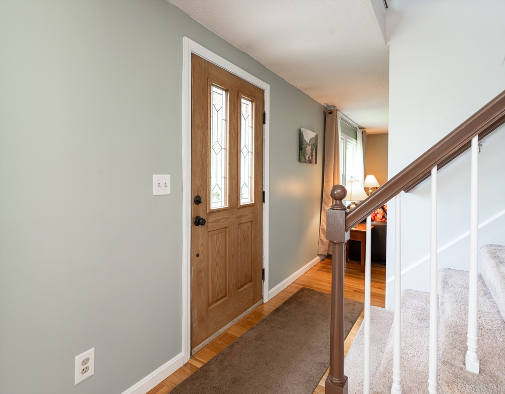 11 Emerson Road Nashua, NH 03062 - Photo 2 of 35 a view of entryway and hall with wooden floor