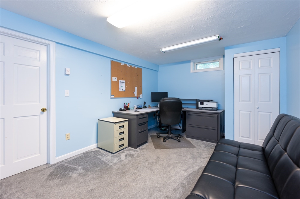 11 Emerson Road Nashua, NH 03062 - Photo 26 of 35 a view of a workspace with furniture and a window