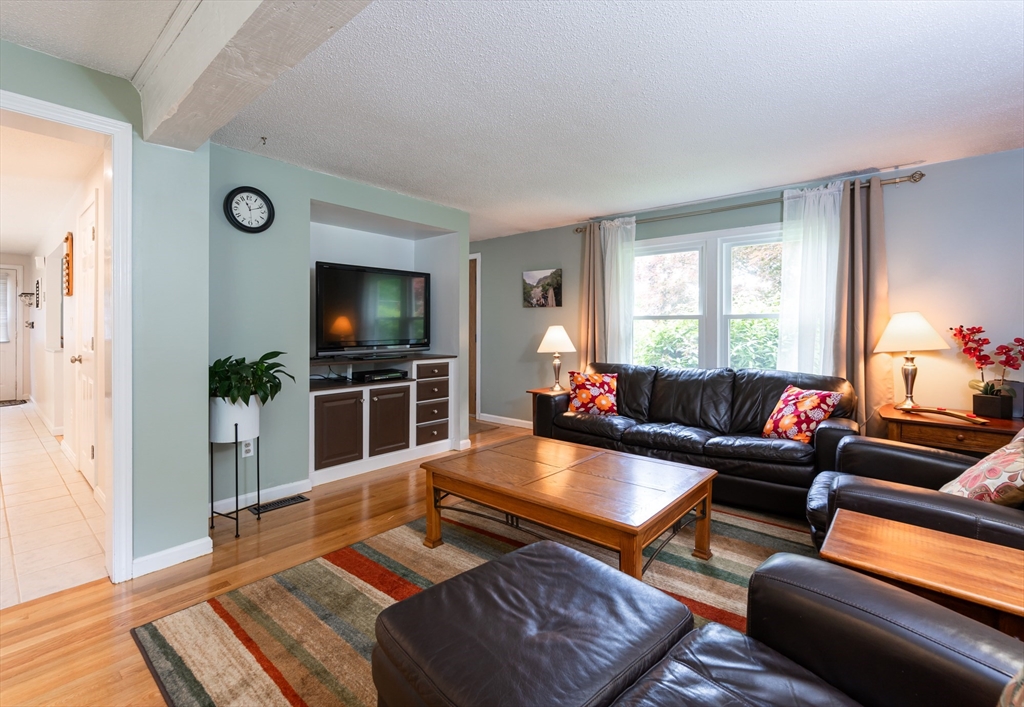 11 Emerson Road Nashua, NH 03062 - Photo 5 of 35 a living room with furniture and a flat screen tv