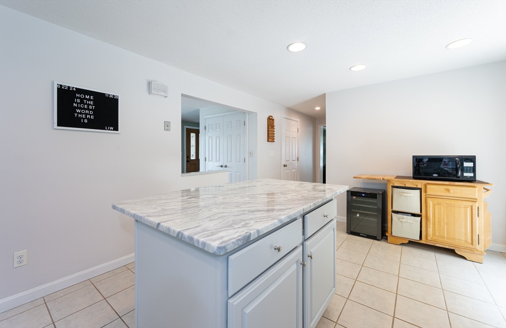 11 Emerson Road Nashua, NH 03062 - Photo 10 of 35 a kitchen with a stove and a sink