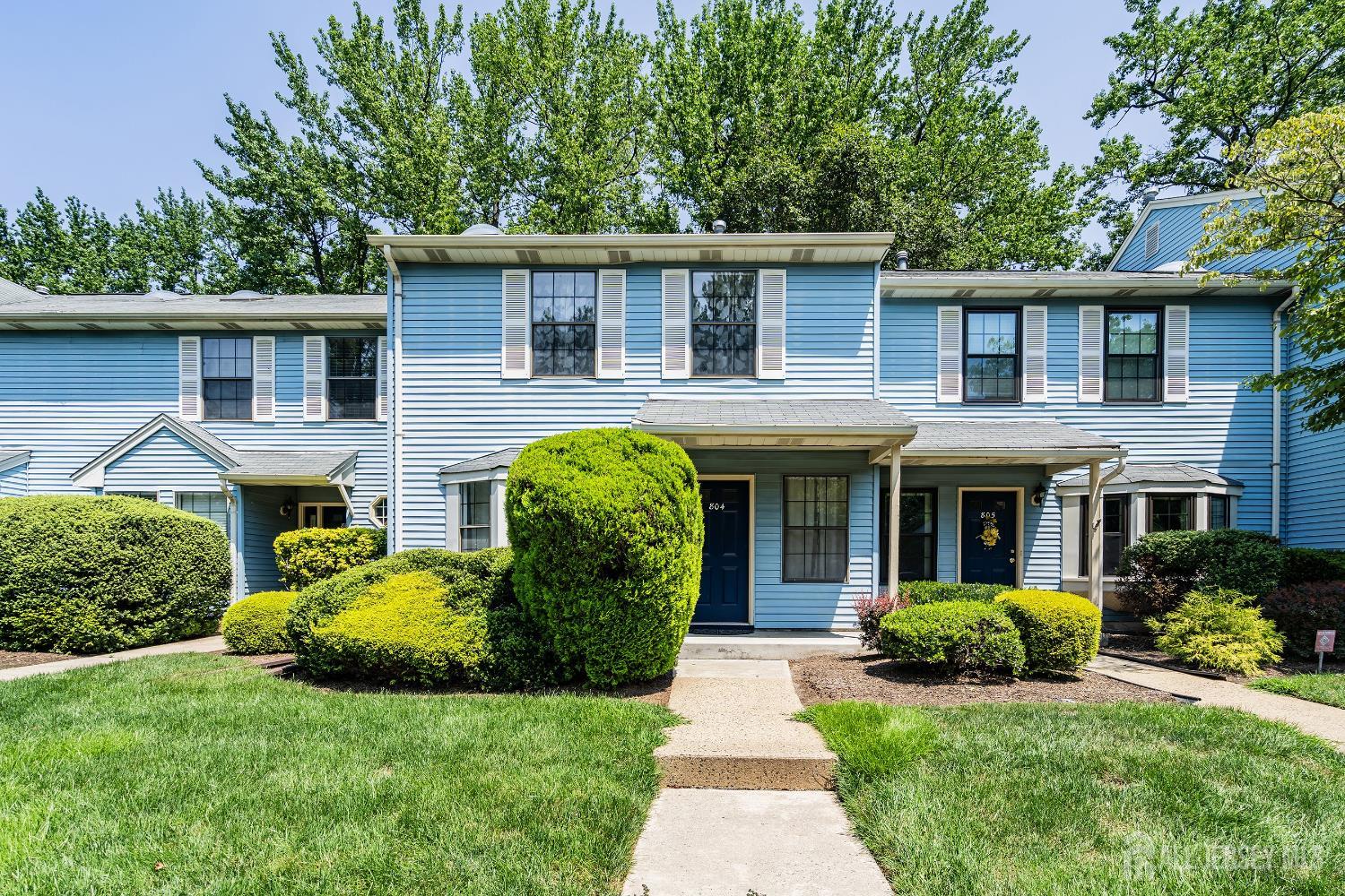 804 Timber Oaks Road Edison, NJ 08820 - Photo 1 of 26 a front view of a house with a garden and plants