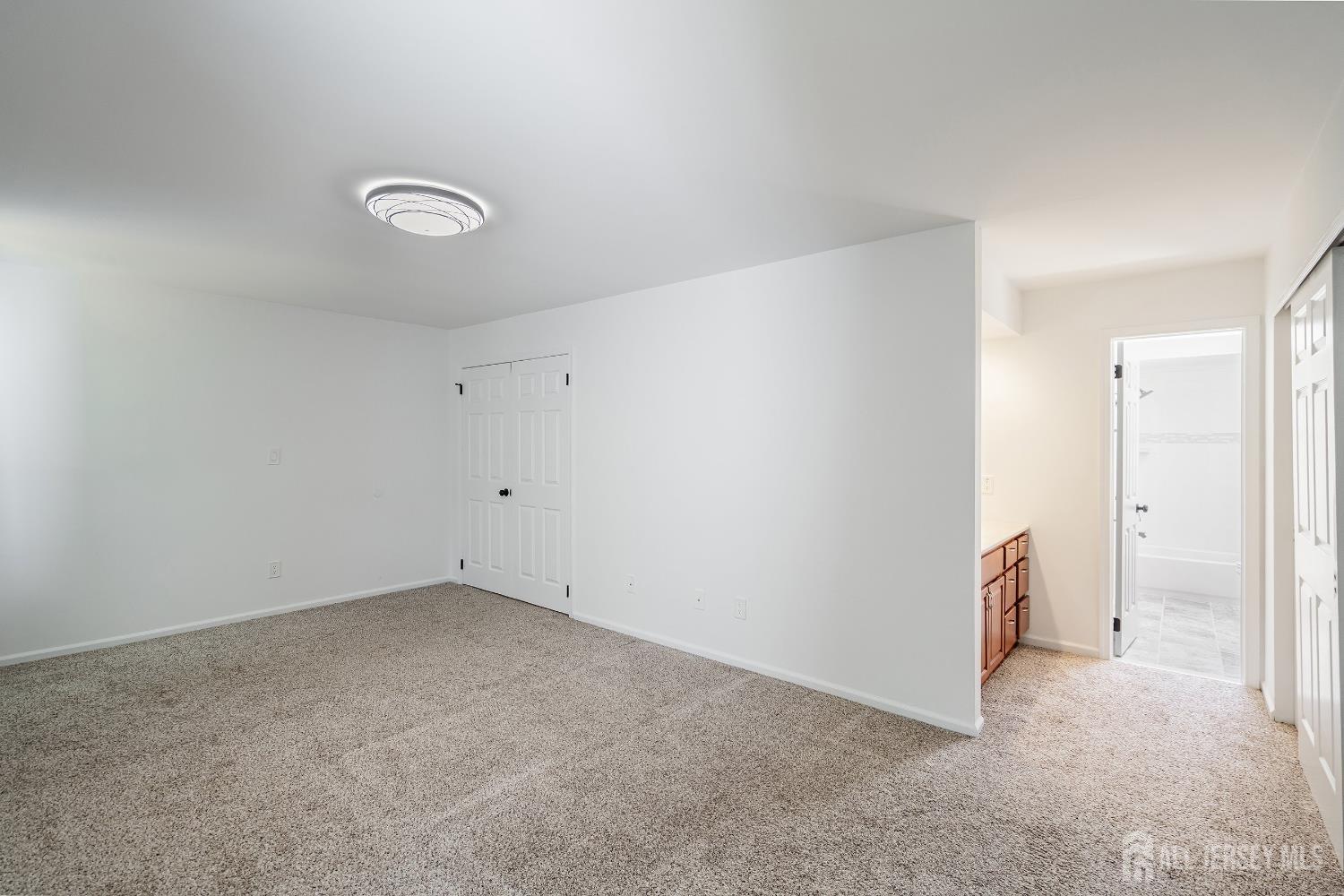 804 Timber Oaks Road Edison, NJ 08820 - Photo 20 of 26 an empty room with a door