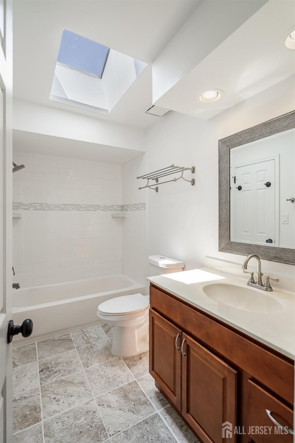 804 Timber Oaks Road Edison, NJ 08820 - Photo 23 of 26 a bathroom with a sink a toilet and shower
