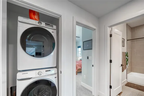 a view of a hallway with washer and dryer