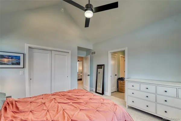 a bedroom with a bed and a dresser