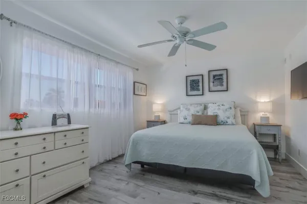 a bathroom with a sink toilet a mirror and shower