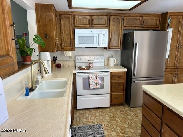 66 Stanford Circle Lompoc, CA 93436 - Photo 12 of 23 a kitchen with stainless steel appliances a refrigerator sink and stove