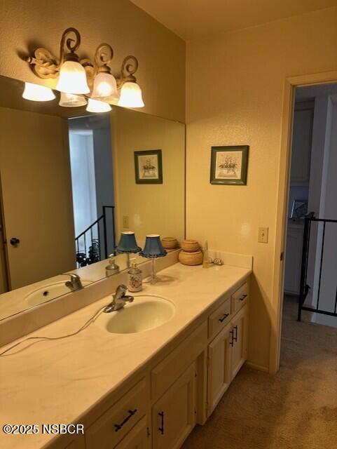 66 Stanford Circle Lompoc, CA 93436 - Photo 21 of 23 a bathroom with a sink and a mirror