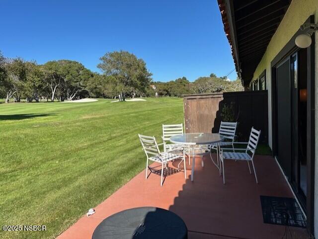 66 Stanford Circle Lompoc, CA 93436 - Photo 9 of 23 a view of a chairs and table in patio with a lake view