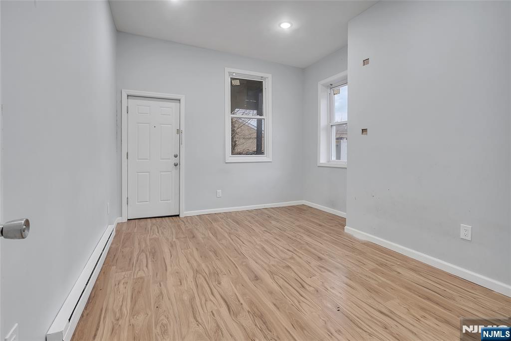 90 Park Avenue Paterson, NJ 07501 - Photo 18 of 42 a view of empty room with wooden floor
