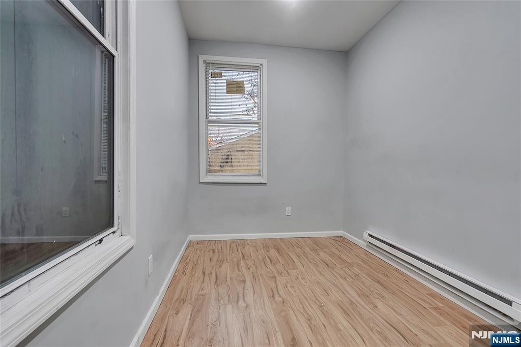 90 Park Avenue Paterson, NJ 07501 - Photo 19 of 42 a view of a room with wooden floor and fan