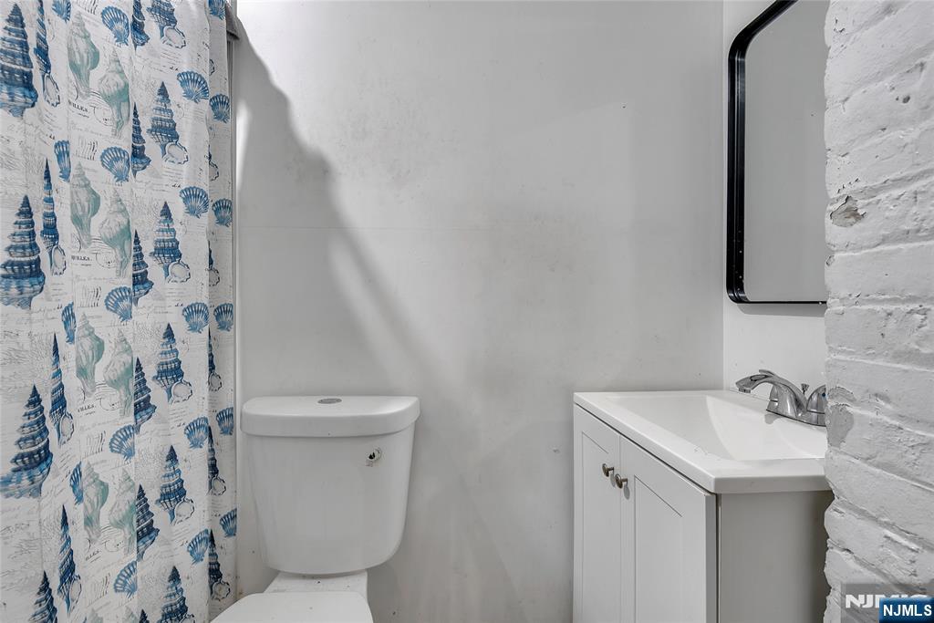 90 Park Avenue Paterson, NJ 07501 - Photo 23 of 42 a bathroom with a sink and toilet