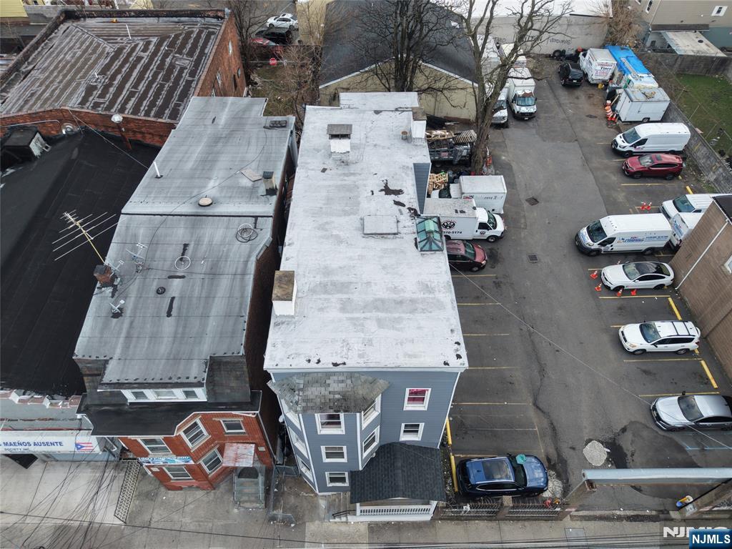 90 Park Avenue Paterson, NJ 07501 - Photo 4 of 42 an aerial view of residential houses with outdoor space