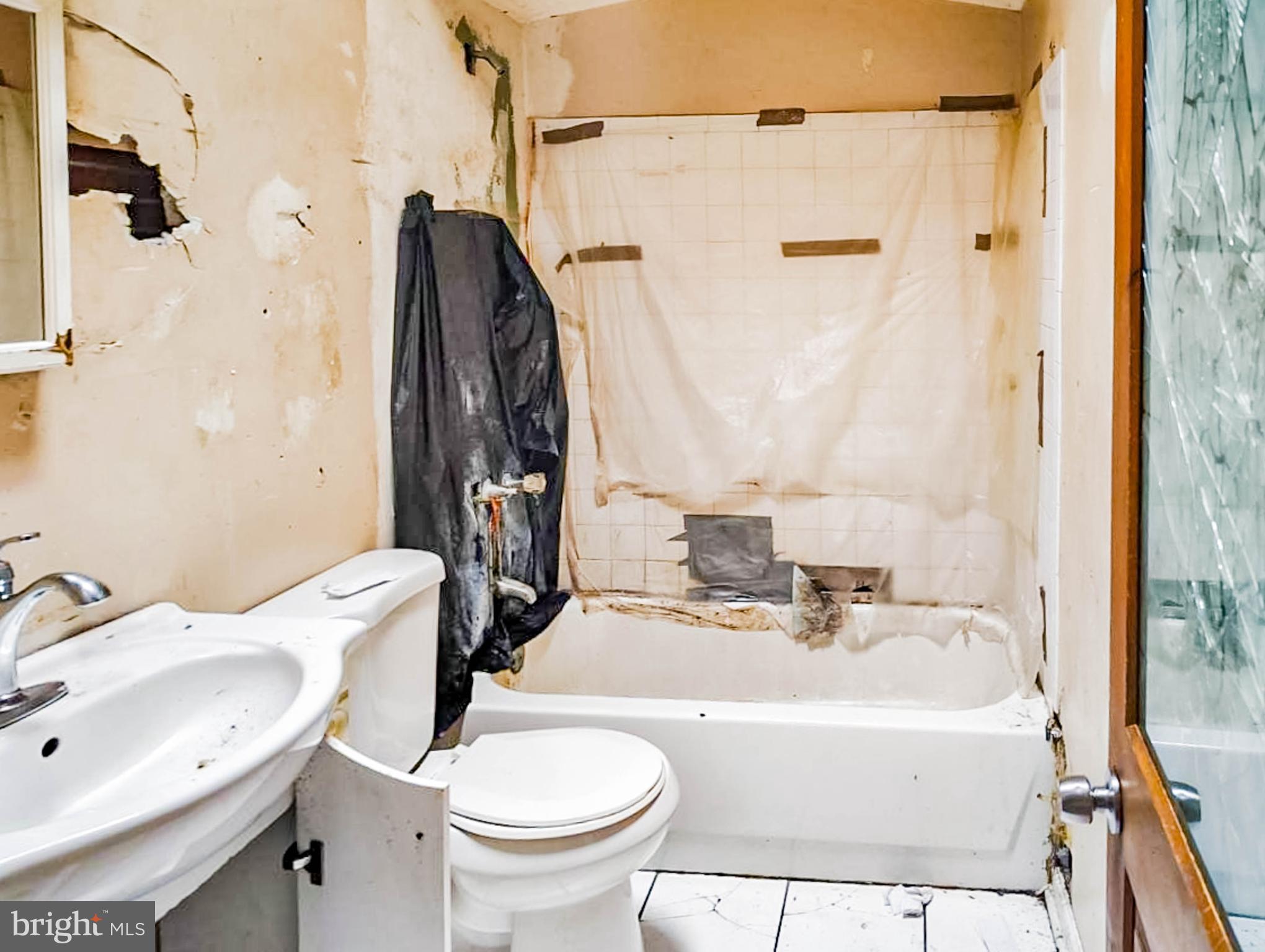 619 Brill Street Philadelphia, PA 19120 - Photo 13 of 18 a bathroom with a sink toilet and shower