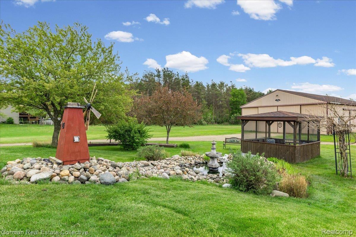 3457 West Burnside Road Columbiaville, MI 48421 - Photo 31 of 45 View of the pond featuring a gazebo
