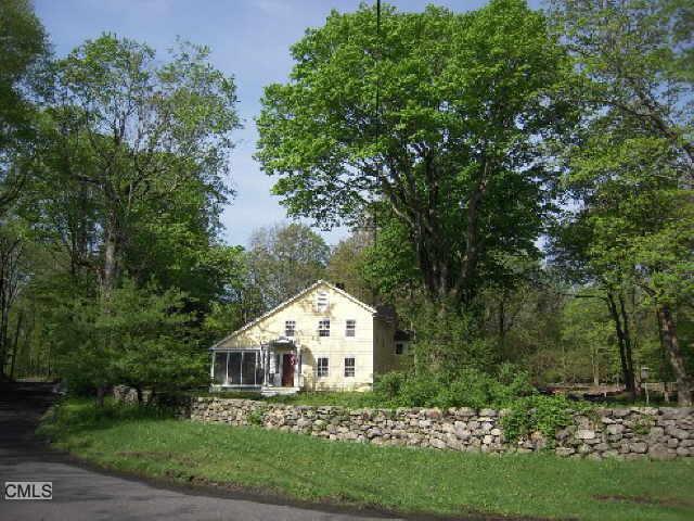 167 Silver Spring Road Ridgefield, CT 06877 - Photo 1 of 1 a view of a house with a yard and potted plants