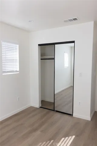 an empty room with wooden floor