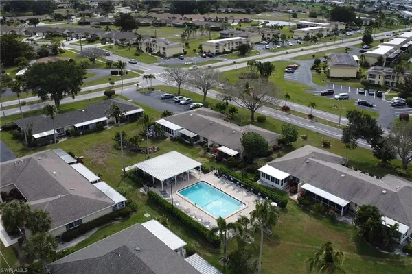 an aerial view of residential houses with outdoor space
