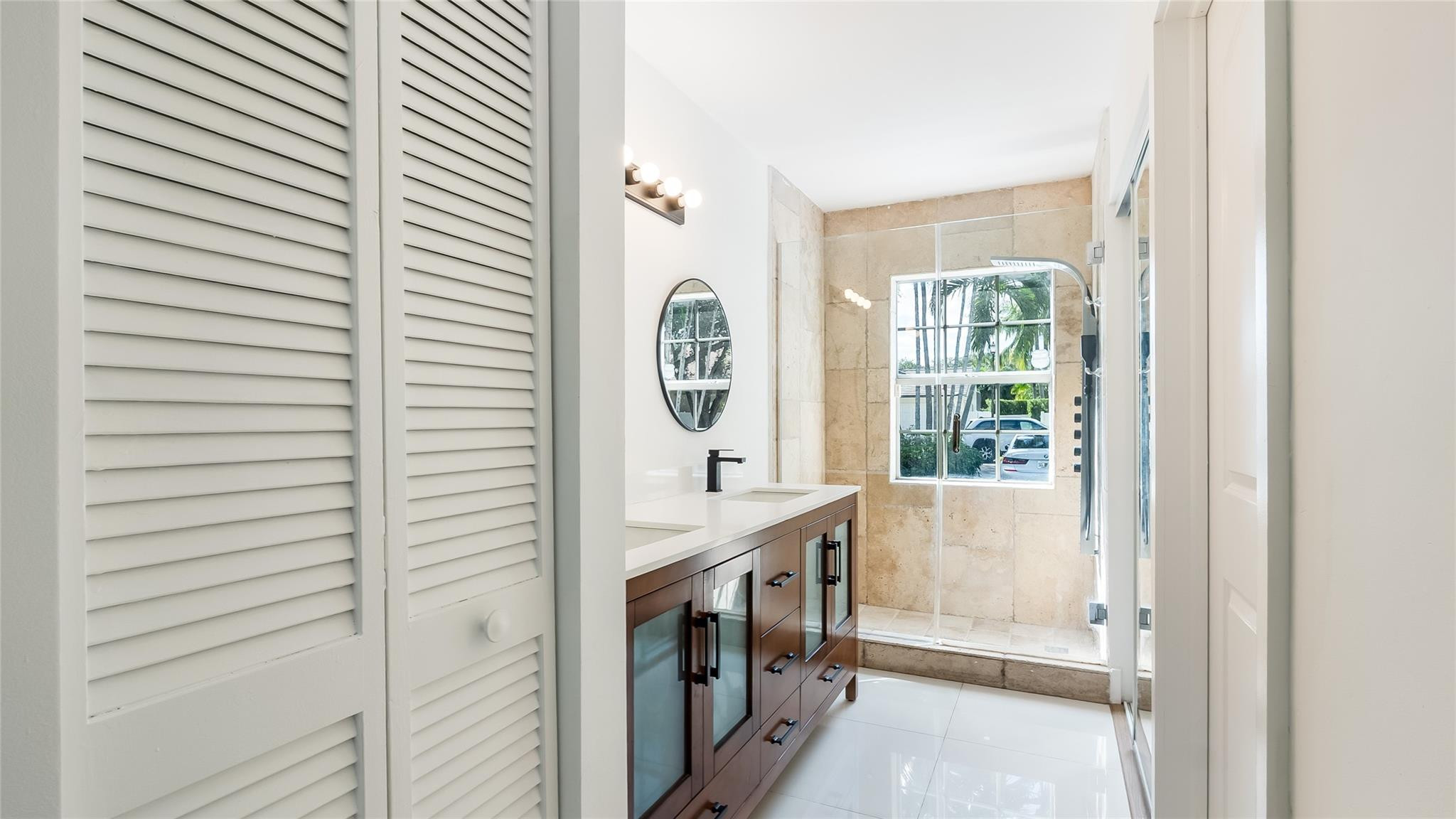 1811 Southwest 124th Way Miramar, FL 33027 - Photo 23 of 28 a bathroom with a bathtub and a window