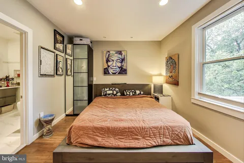 a living room with bookshelf and a book shelf