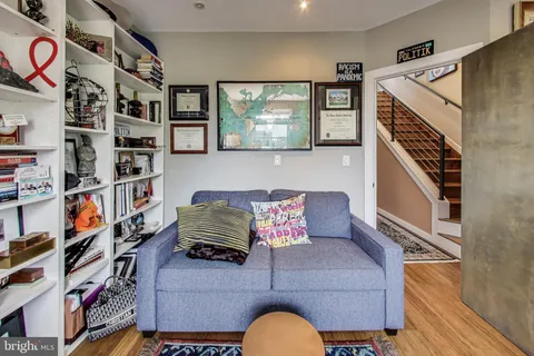 a swimming pool with outdoor seating and yard view