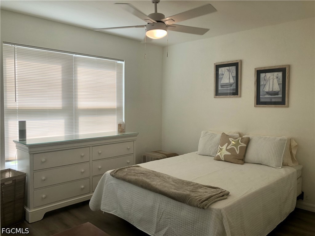 16881 Davis Road, Unit 214 Fort Myers, FL 33908 - Photo 15 of 46 a bedroom with a bed and a window