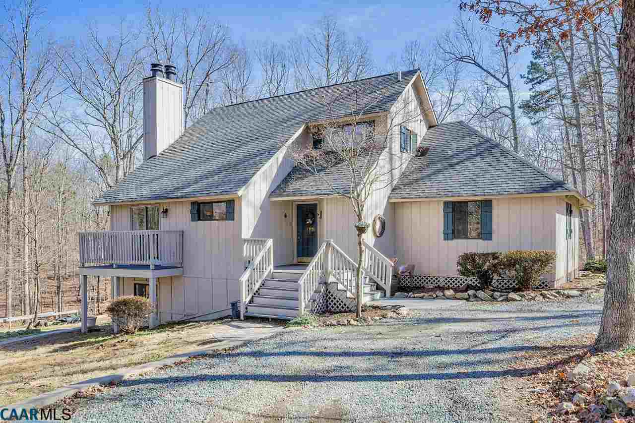 4776 Woodbound Road Keswick, VA 22947 - Photo 1 of 32 a front view of a house with plants