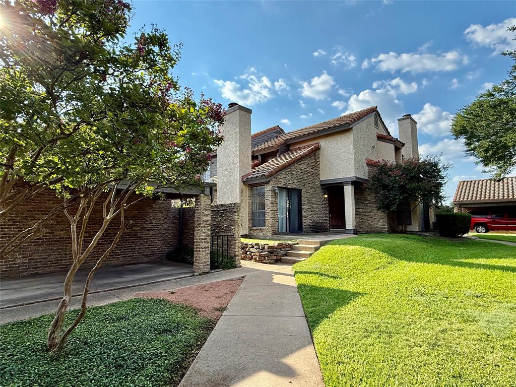 777 Custer Road, Unit 23 Richardson, TX 75080 - Photo 28 of 28 Mediterranean / spanish home with a chimney, a front lawn, stucco siding, and a tile roof