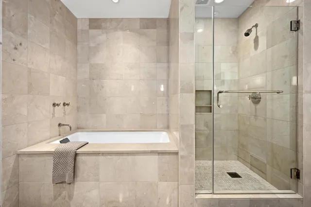 a bathroom with a shower and a bathtub