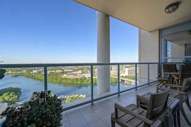 a lobby with furniture and floor to ceiling window