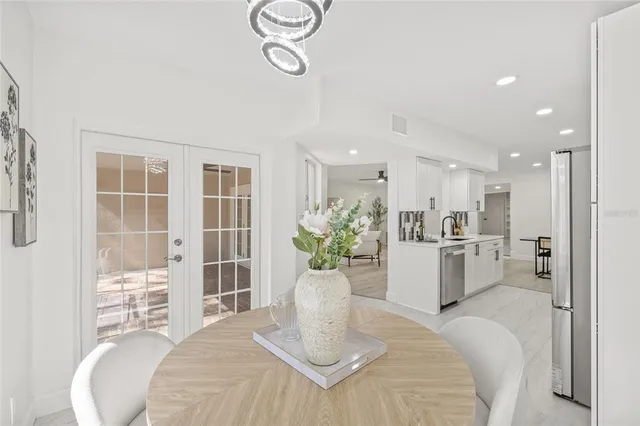 a bedroom with a bed and chandelier