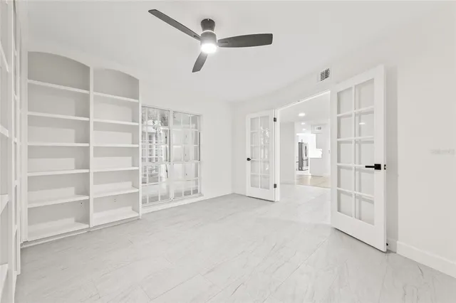 a view of an empty room with a window