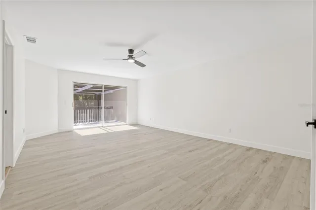 a view of an empty room with a window