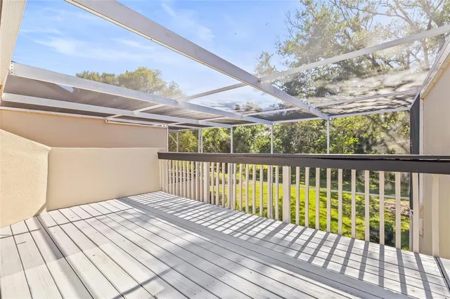 a balcony with wooden floor