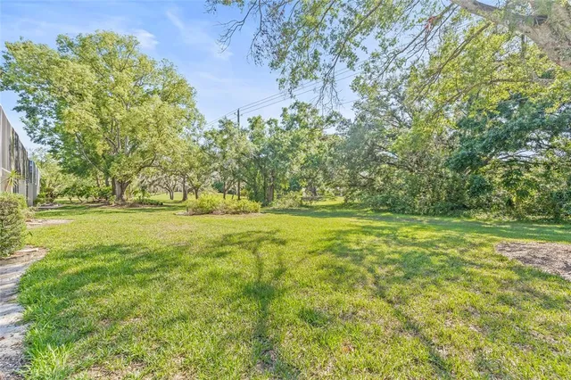a view of outdoor space with deck area and trees