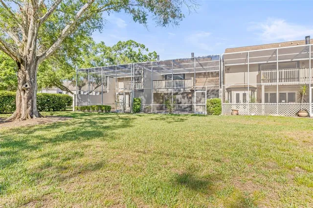 a front view of a building with a garden
