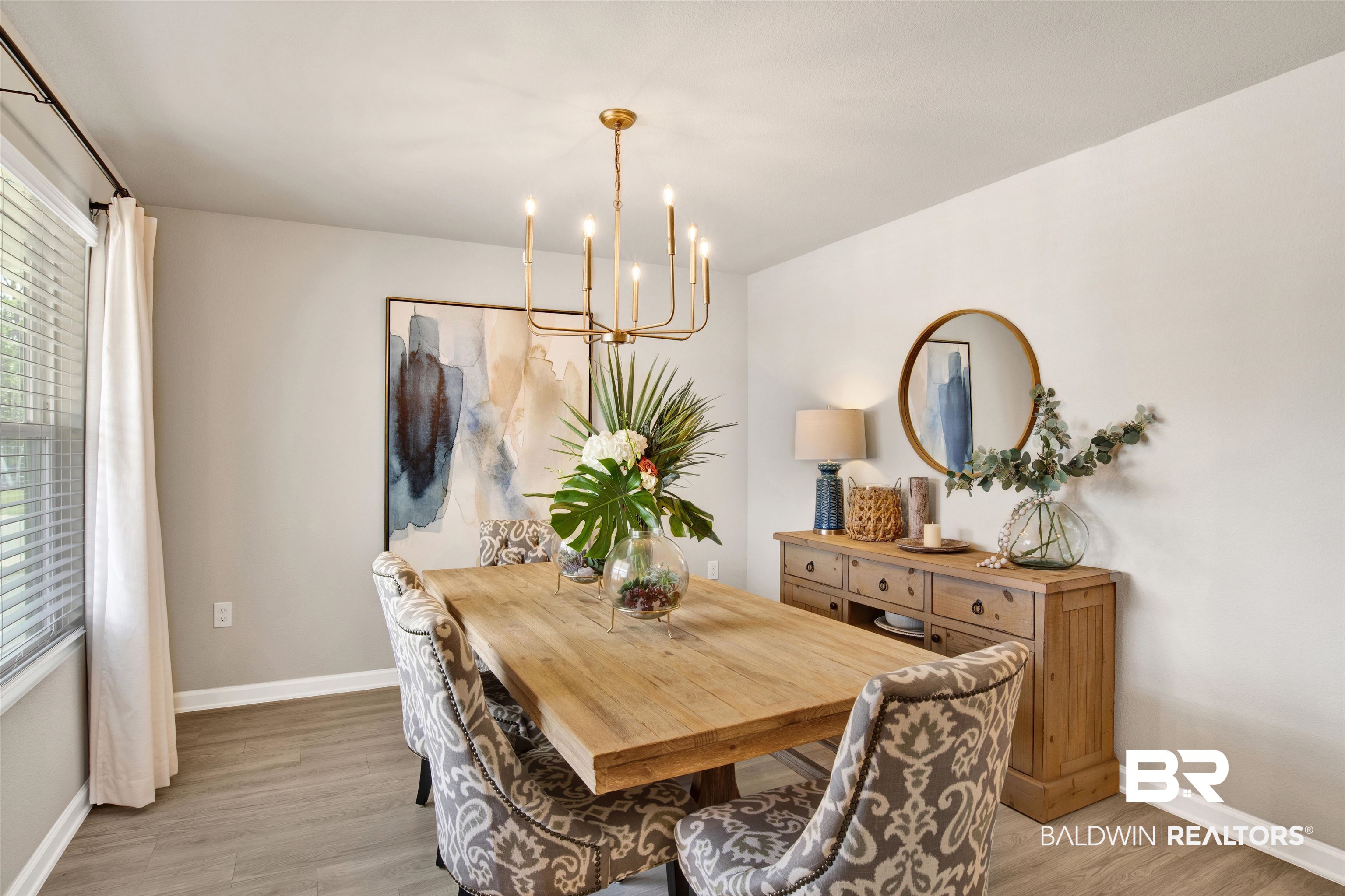 24532 Broken Sound Loop Orange Beach, AL 36561 - Photo 7 of 29 Dining space featuring light hardwood / wood-style flooring and a notable chandelier