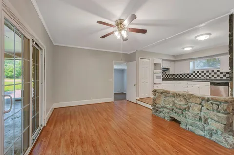 a view of livingroom with hardwood floor and ceiling fan