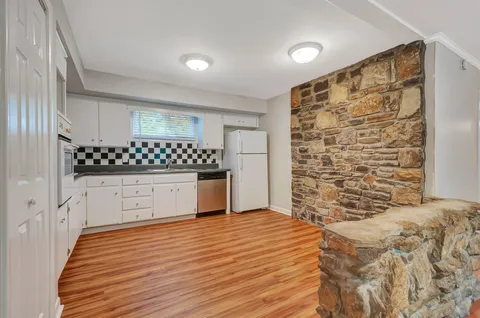 a bedroom with a large bed and a dresser