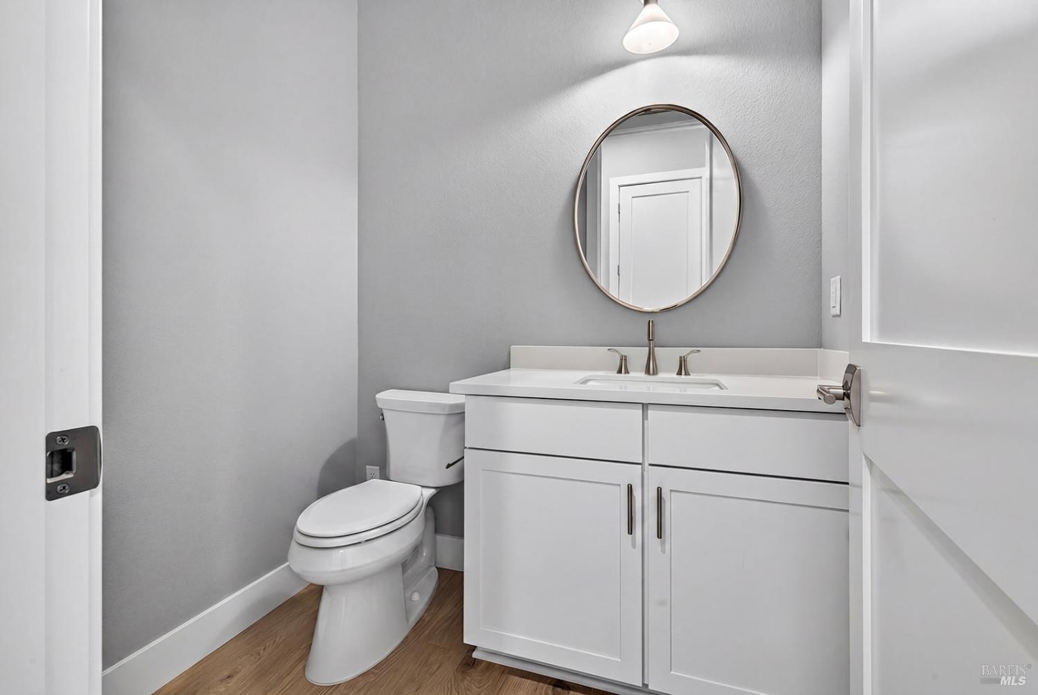 1913 Carlile Place Santa Rosa, CA 95403 - Photo 23 of 60 This powder room is located on the main level in the hallway that leads to the 3-car tandem garage and main level primary suite.