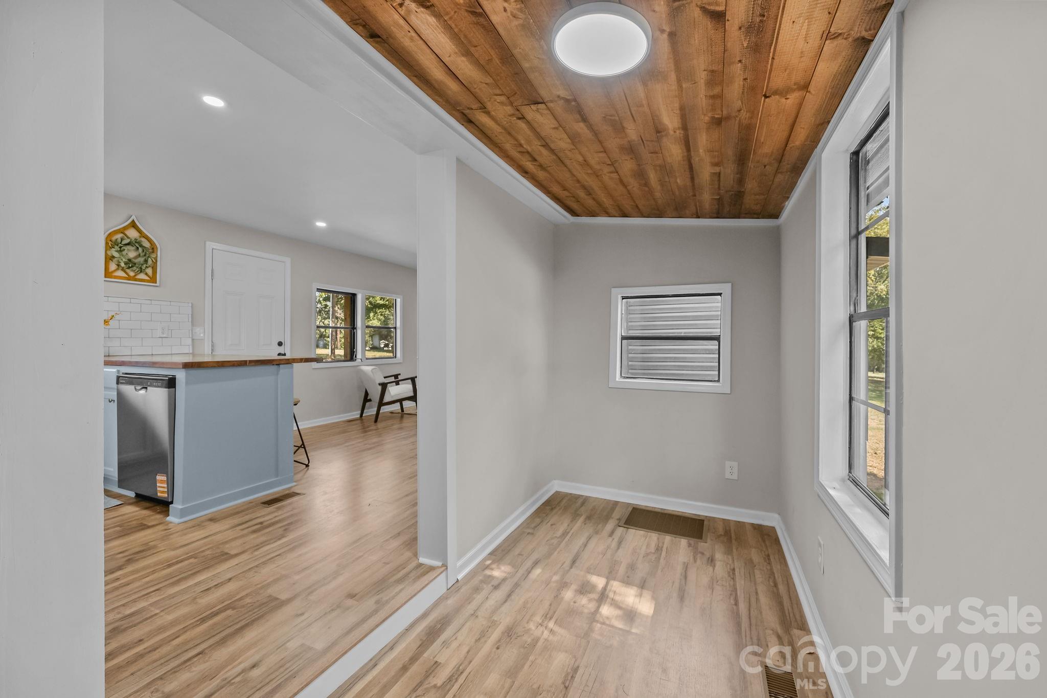 1315 King Road Salisbury, NC 28146 - Photo 16 of 41 wooden floor in an empty room with a window