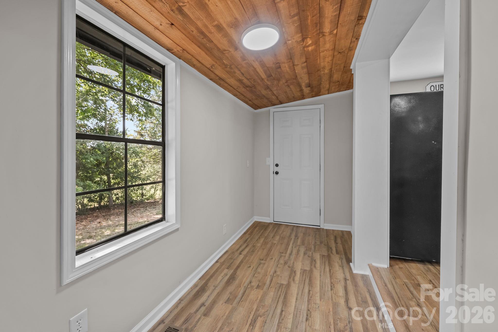 1315 King Road Salisbury, NC 28146 - Photo 17 of 41 a view of a room with wooden floor and windows