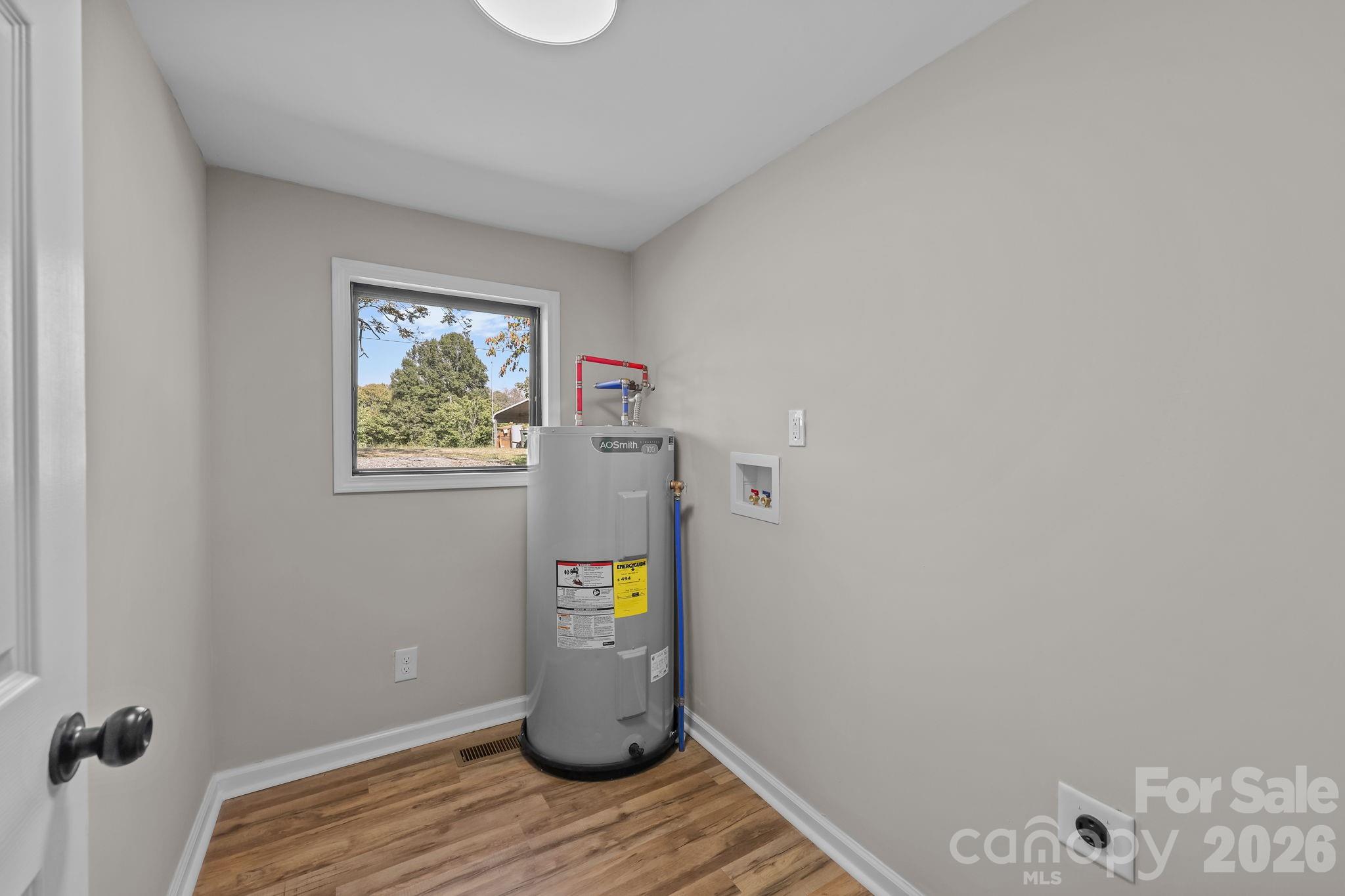1315 King Road Salisbury, NC 28146 - Photo 18 of 41 a view of a storage & utility room with wooden floor