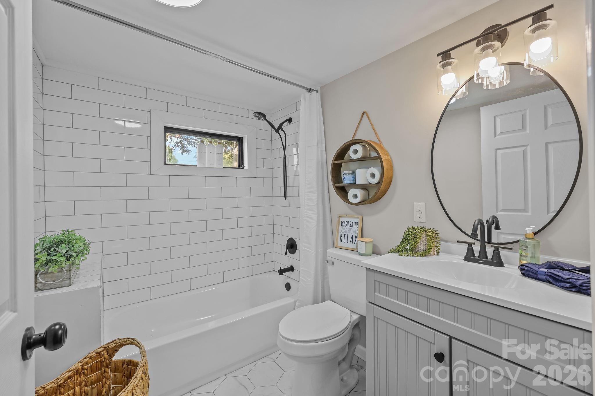 1315 King Road Salisbury, NC 28146 - Photo 19 of 41 a bathroom with a toilet a sink and a bathtub